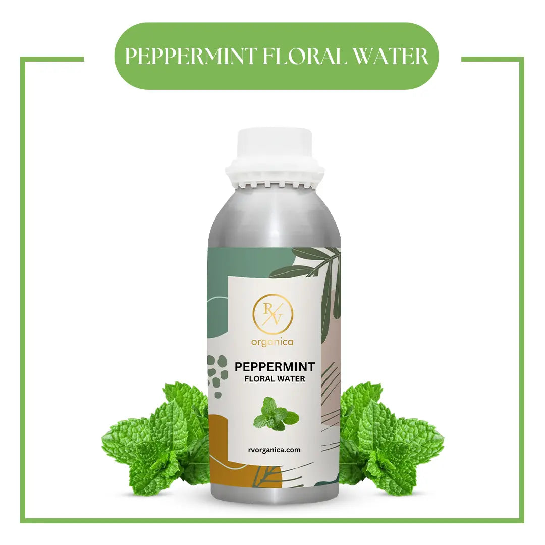 A bottle of peppermint floral water with fresh peppermint leaves around it, displaying a label with the brand and product name.