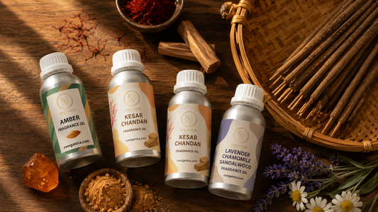 Fragrance oil bottles featuring Amber, Kesar Chandan and Lavender Chamomile Sandalwood scents with saffron, sandalwood and incense sticks