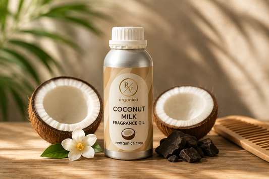 RV Organica Coconut Milk Fragrance Oil bottle with fresh coconut halves and wooden comb on a wooden surface