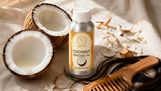 RV Organica coconut massage oil bottle with fresh coconut halves and wooden hair comb