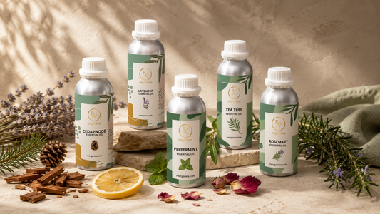 Premium RV Organica essential oil collection featuring lavender, peppermint, cedarwood, tea tree, and rosemary essential oil aluminum bottles arranged with fresh botanicals on a warm textured surface in luxury organic product photography.