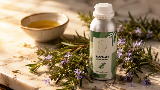 RV Organica pure rosemary essential oil bottle with fresh rosemary sprigs
