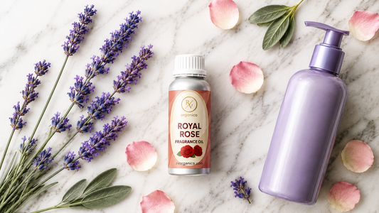 Royal Rose fragrance oil with lavender and shampoo bottle on white marble flat lay.