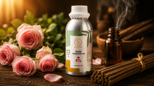 RV Organica Rose Fragrance Oil for agarbatti in aluminium bulk bottle with fresh pink roses and incense sticks on wooden background