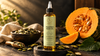 Pumpkin seed oil bottle with pumpkin seeds and fresh pumpkin on dark slate surface