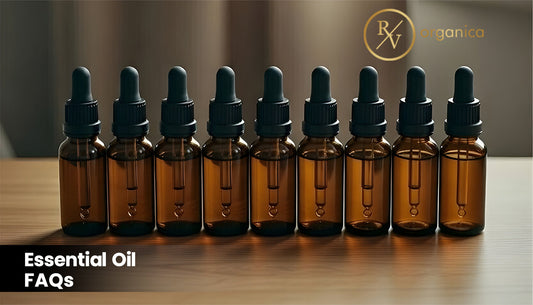 Essential Oil FAQs banner with amber glass dropper bottles – guide to aromatherapy oils and natural essential oil uses