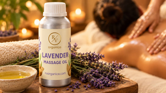 Lavender oil for body massage, an RV Organica Lavender Massage Oil bottle with fresh lavender and a bowl of oil beside a relaxing back massage in a candlelit spa