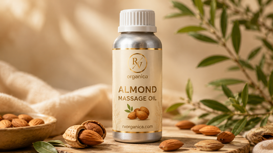 RV Organica almond massage oil bottle with almonds and botanical leaves on a premium natural skincare background