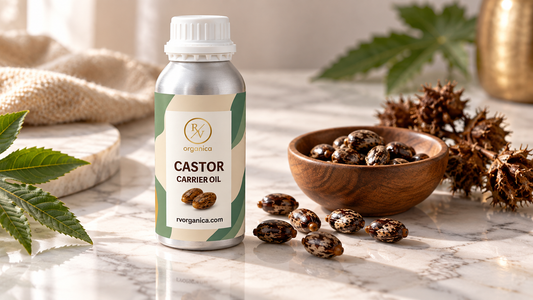 Castor carrier oil in an aluminum bottle with castor beans on a white marble surface, natural skincare product photography