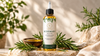 RV Organica Rosemary Hair Oil bottle with rosemary sprigs and natural hair oil in a premium wellness setting