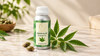 Premium neem aloe fragrance oil in amber glass bottle with fresh neem leaves and aloe vera on marble surface.