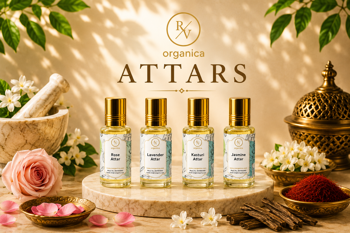 Premium RV Organica Attars collection featuring Rose Attar, Lavender Attar, Kasturi Attar, and Jasmine Attar in elegant 15ml glass bottles with golden caps, displayed on a luxury marble podium with floral accents.