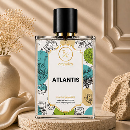 RV Organica Atlantis fragrance oil bottle showcased with decorative vase and textured stone accents