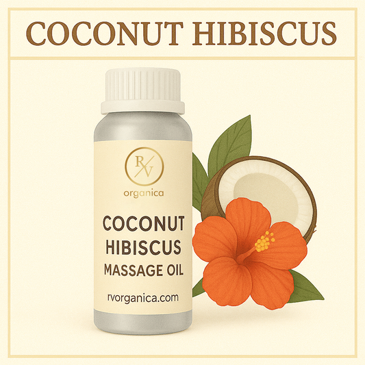 A bottle of Coconut Hibiscus Massage Oil with a white cap, labeled with RV Organica, a halved coconut, and a red hibiscus flower.