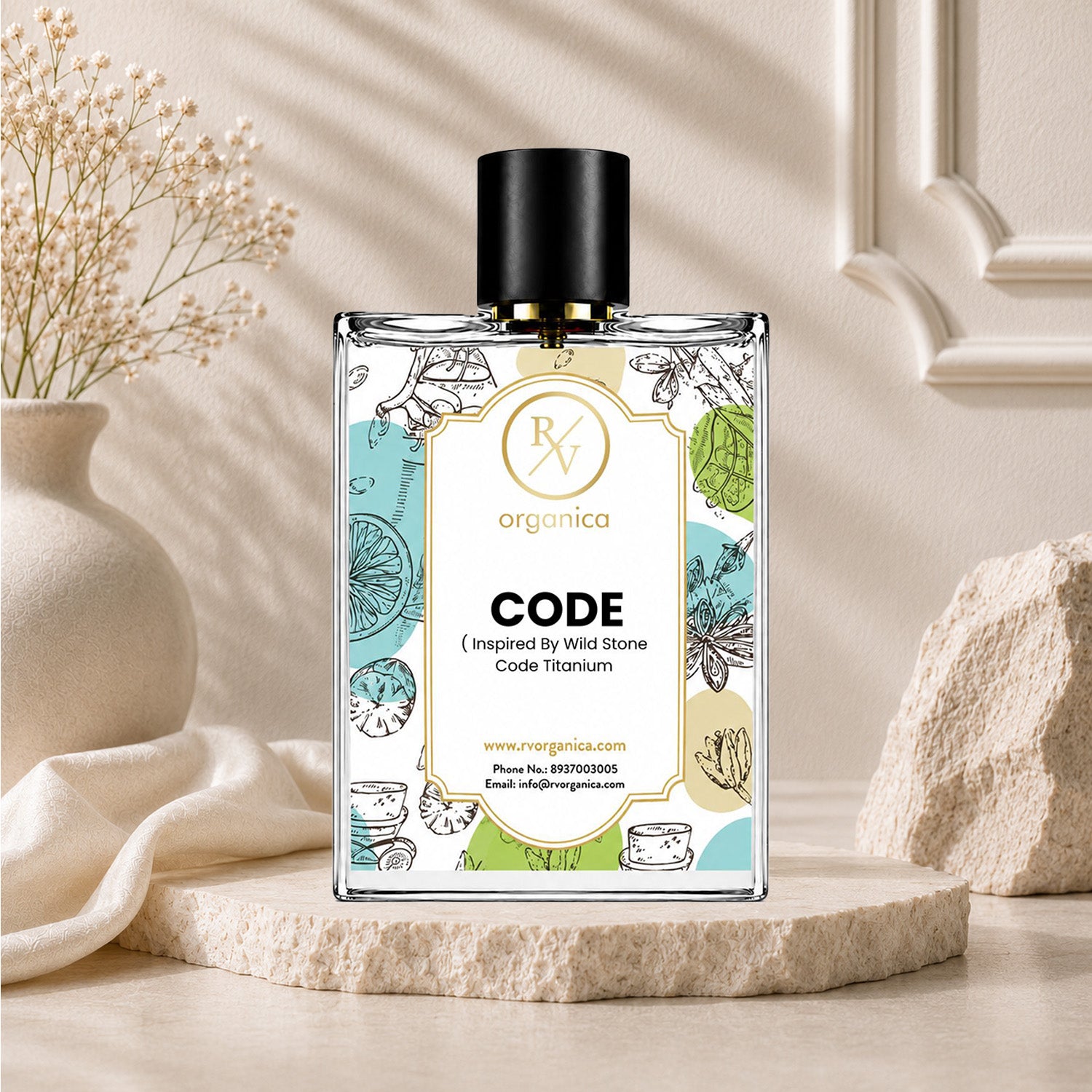 RV Organica Code fragrance oil bottle showcased with decorative vase and textured stone accents