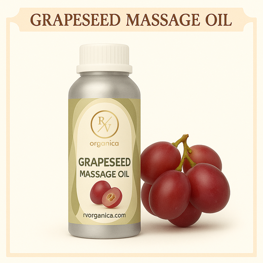 A bottle of Grapeseed Massage Oil with a white cap, labeled with RV Organica and the product name. The bottle is accompanied by a small cluster of fresh grapes.