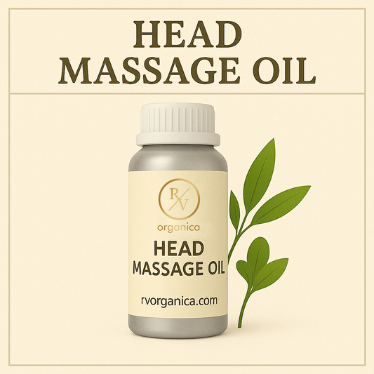 A bottle of Head Massage Oil with RV Organica displayed on the label. The background is beige with a sprig of leaves to the side.