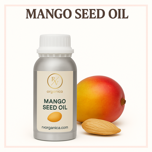 A bottle of Mango Seed Oil with a fresh mango and an almond nut next to it, indicating the product's natural source.