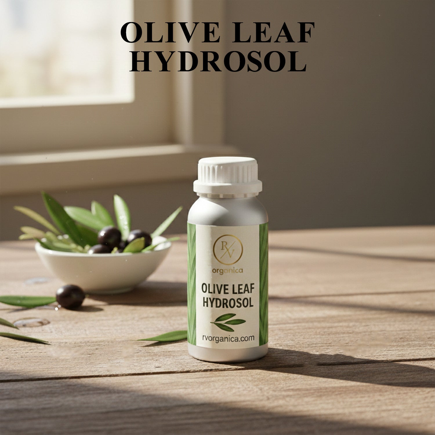 Organic Olive Leaf Hydrosol facial mist bottle with fresh olives and leaves, natural skin toner for hydration and glowing skin.