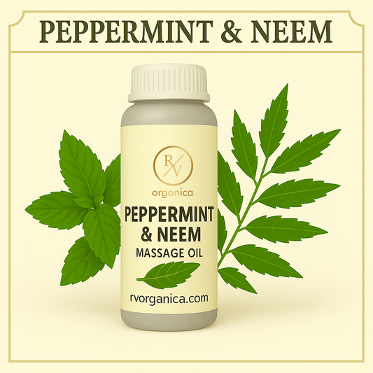 A bottle of Peppermint & Neem Massage Oil by RV Organica, accompanied by leaves of peppermint and neem to the side.