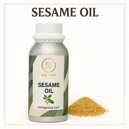 A bottle of RV Organica Sesame Oil alongside a small pile of sesame seeds, with the product name and website visible on the label.