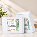 RV Organica Soy Wax Candle Making Kit white gift boxes with branded labels displayed on a marble countertop