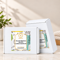 RV Organica Yellow Beeswax Pellets Candle Making Kit white gift boxes with branded labels on a marble countertop
