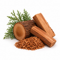 RV Organica Cedarwood logs with wood shavings and green branches on white background