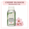 Cherry blossom fragrance oil bottle with flowers on a white background