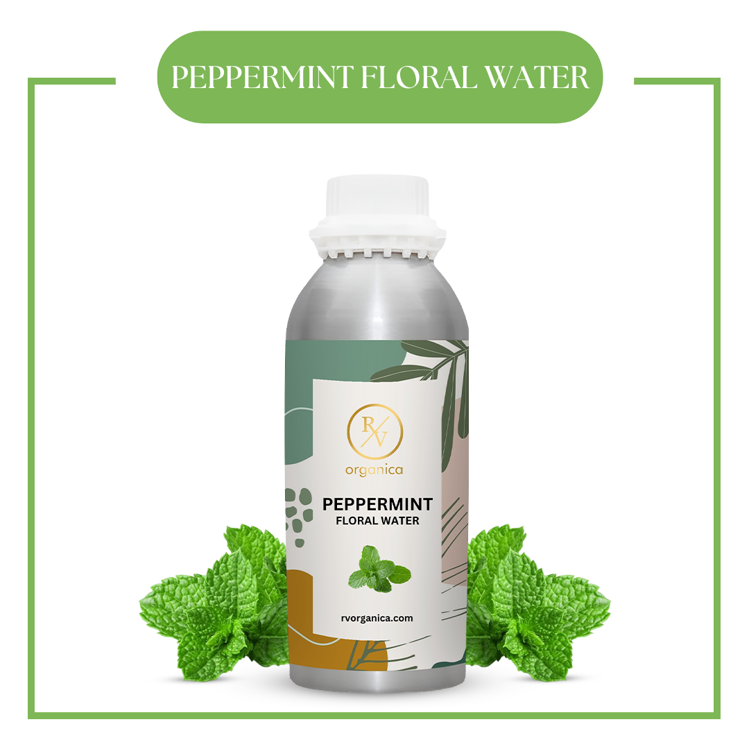 A bottle of peppermint floral water with fresh peppermint leaves around it, displaying a label with the brand and product name.