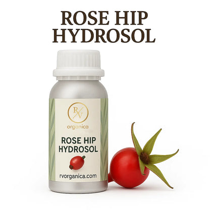 A bottle labeled 'ROSE HIP HYDROSOL' from RV Organica, with a small rose hip fruit next to it.