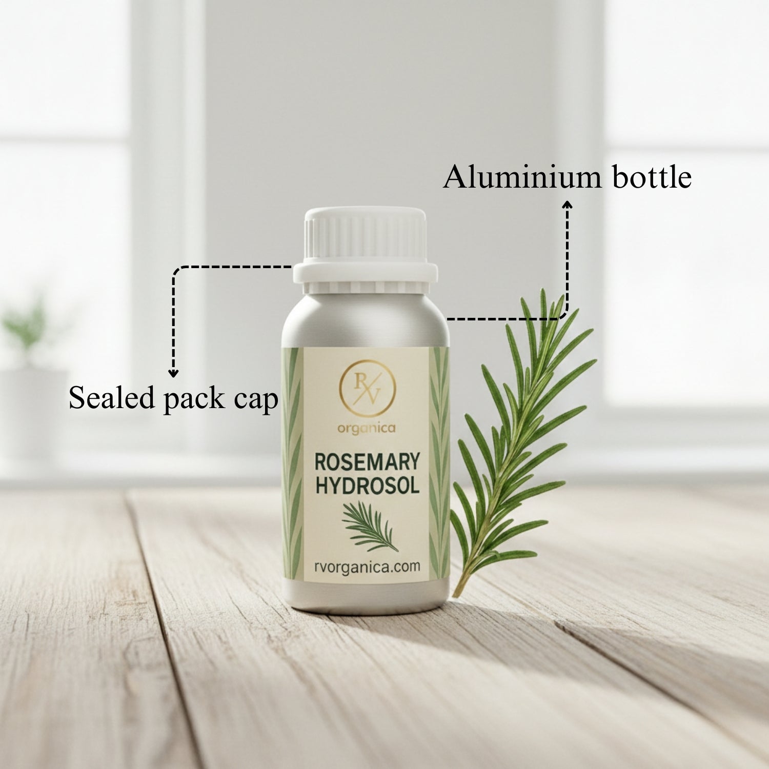 Rosemary Hydrosol in aluminium bottle with sealed pack cap, natural organic skincare toner with fresh rosemary sprigs on wooden surface.