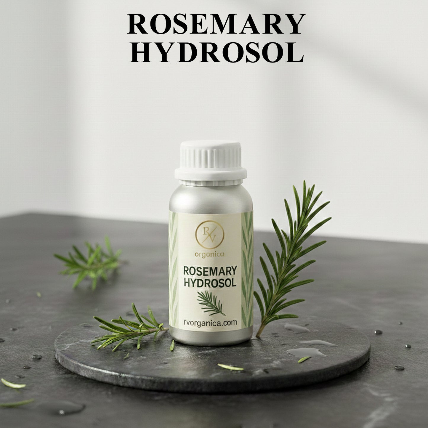 Organic Rosemary Hydrosol facial mist bottle with fresh rosemary leaves, natural herbal skin toner for hydration and daily skincare routine.