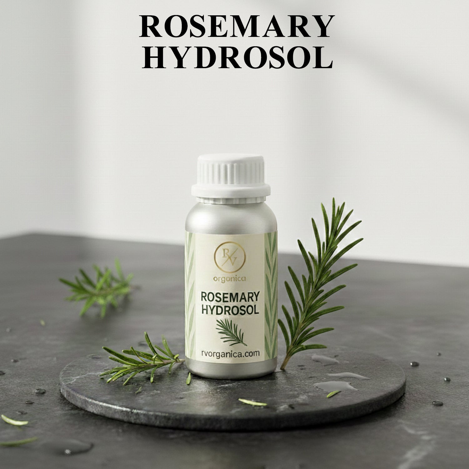 Organic Rosemary Hydrosol facial mist bottle with fresh rosemary leaves, natural herbal skin toner for hydration and daily skincare routine.