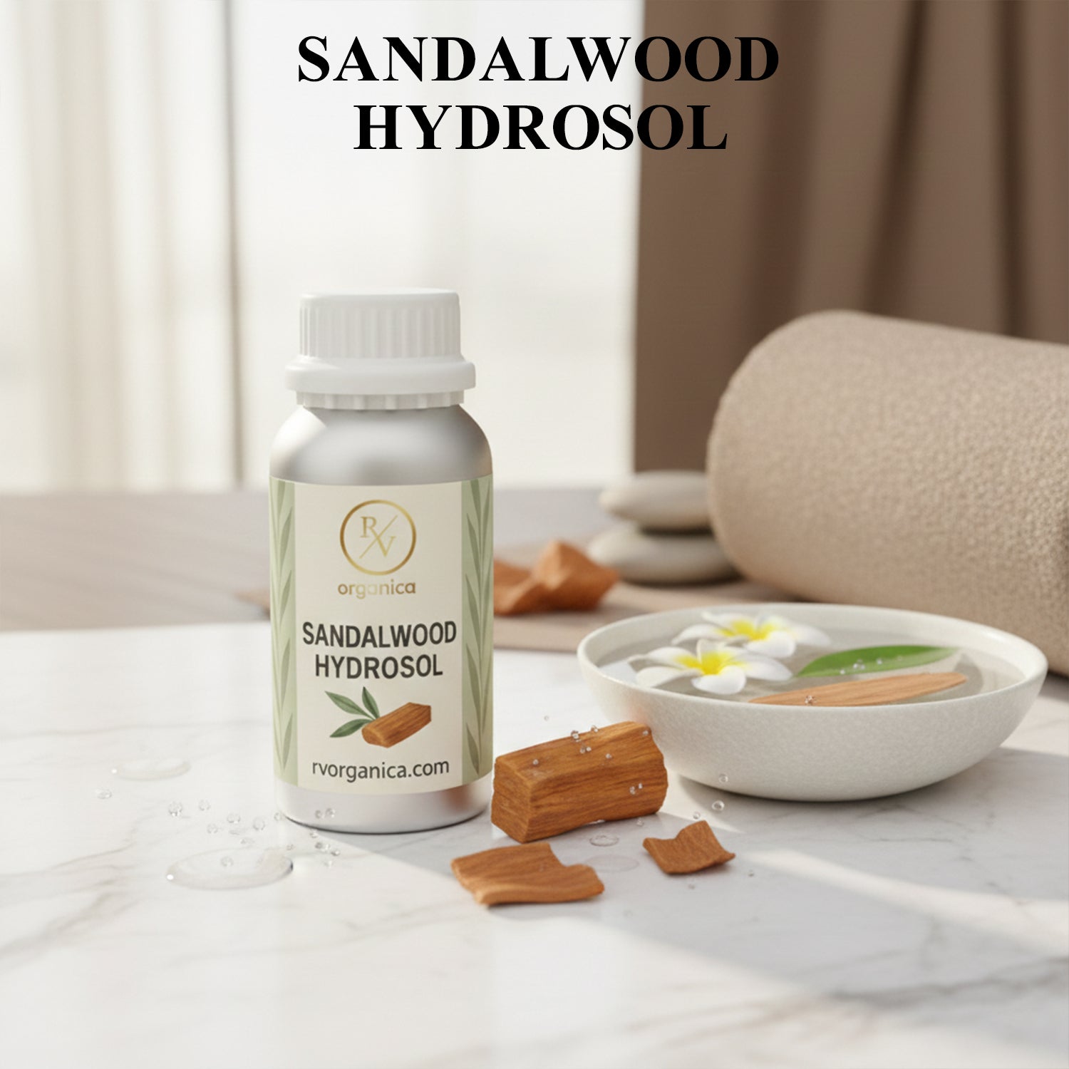 Organic Sandalwood Hydrosol facial mist bottle with sandalwood pieces and spa setting, natural skin toner for hydration and glow.