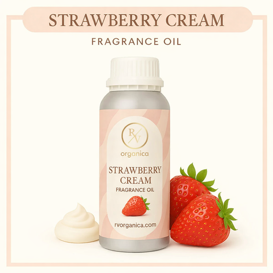 Strawberry cream fragrance oil bottle with strawberries and whipped cream on a light pink background